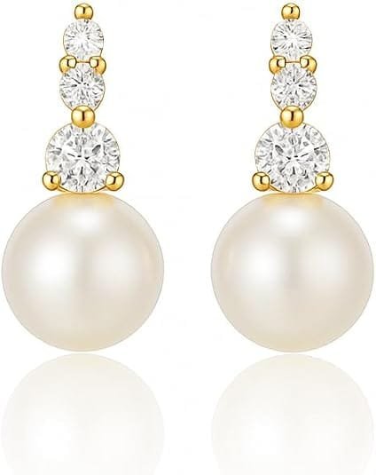 Pair of pearl drop earrings with three vertically stacked cubic zirconia stones in a gold-toned setting